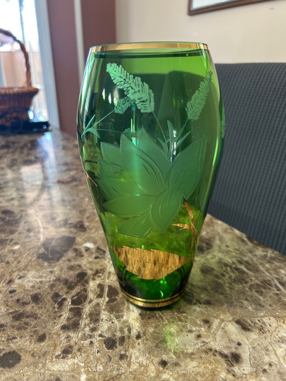 Antique hand-blown green glass vase with etched floral motifs and gold trim
